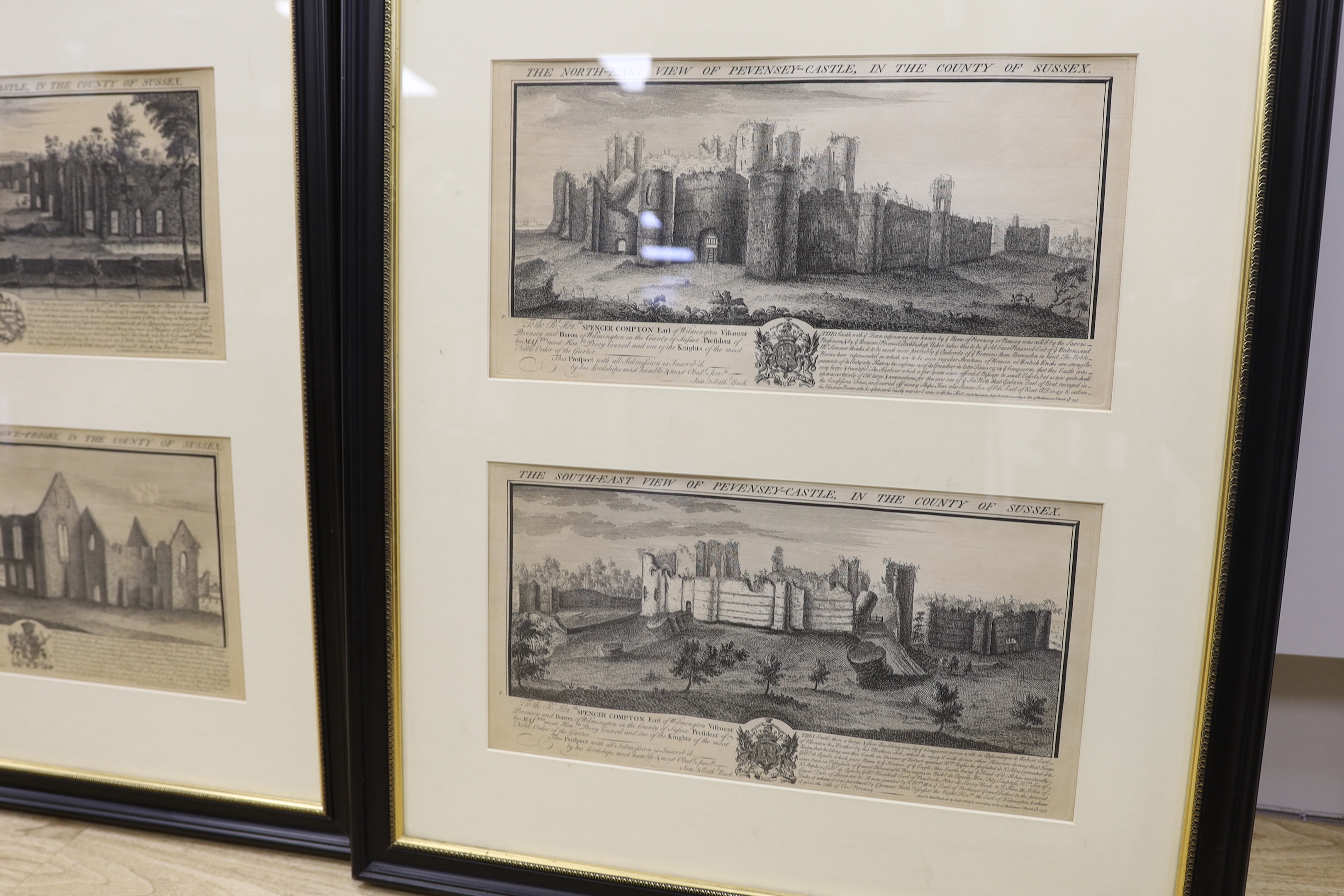 S & N. Buck. A set of twelve 18th century black and white engravings of Sussex Castles and Priories, including Pevensey Castle and Bodiam Castle, framed as three, 38 x 19cm